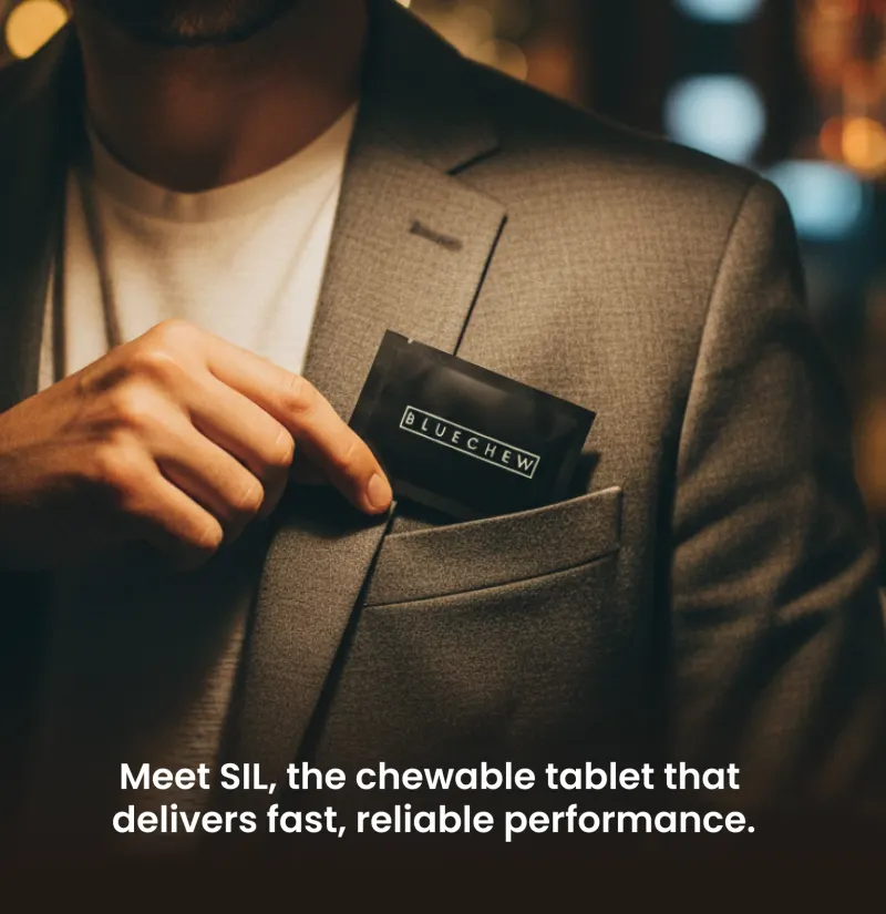 Man tucking a discreet BlueChew packet into his jacket pocket