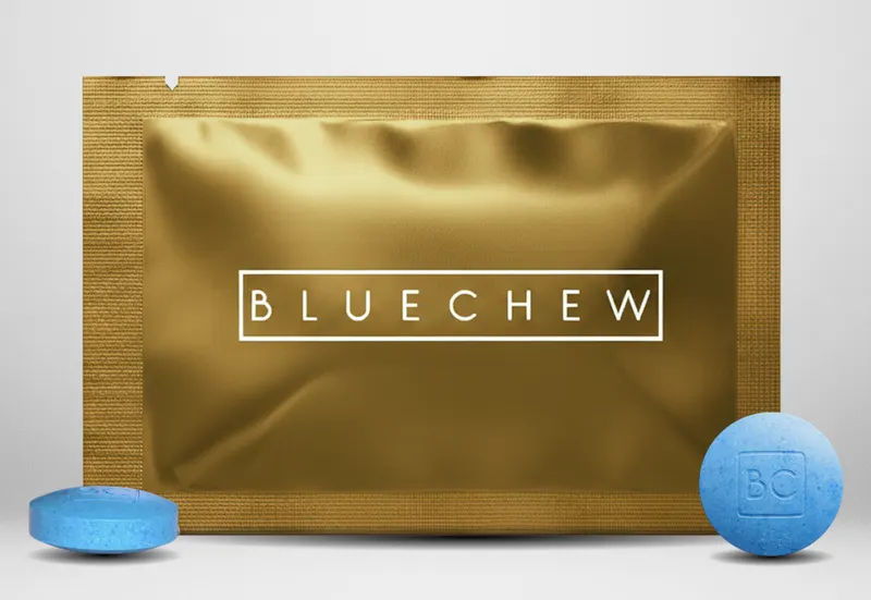 bluechew gold packet on white background with bluechew tablets
