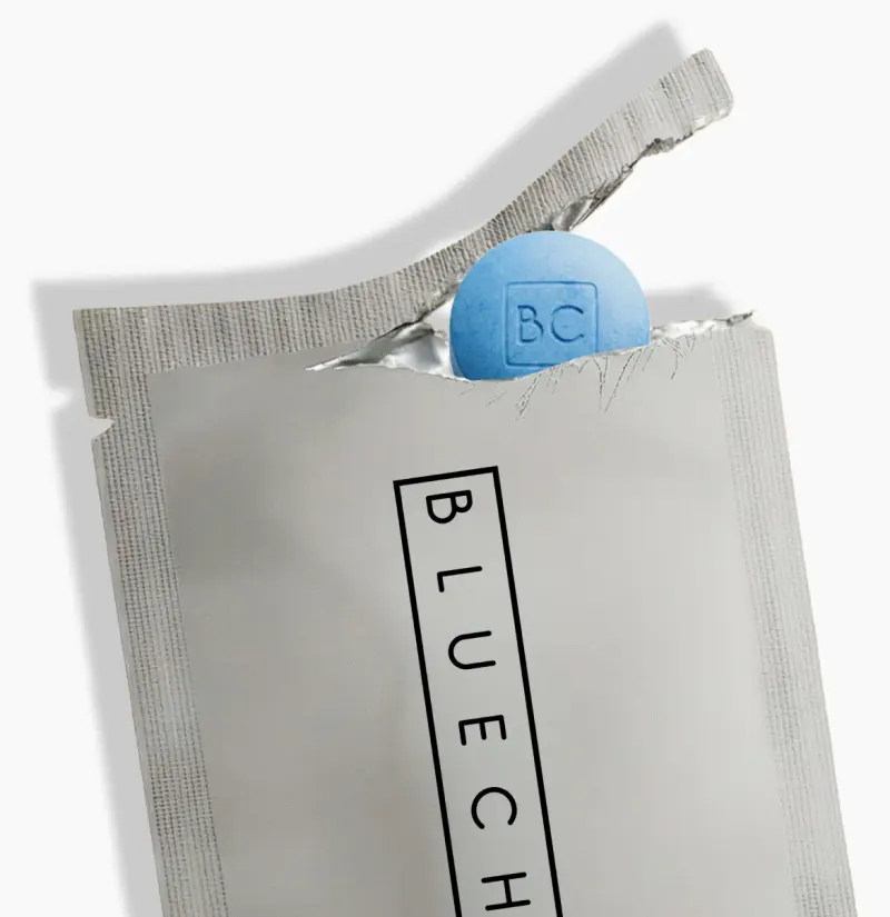 bluechew tadalafil grey packet torn with blue pill