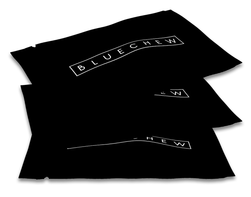 Stack of black BlueChew packets fanned out.