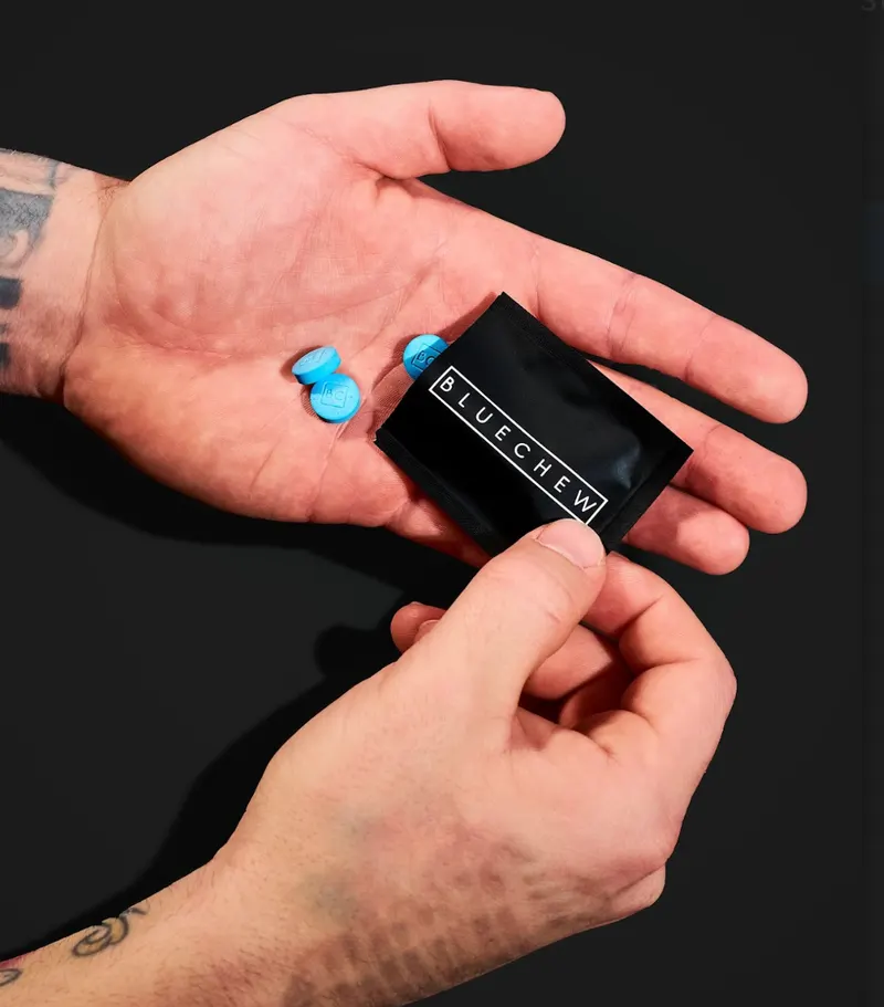 bluechew sildenafil tablets poured into mans palm 