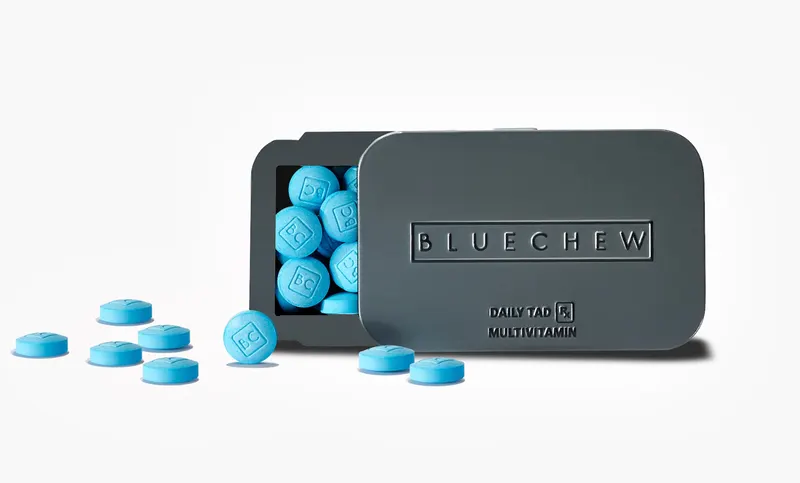 Two DailyTAD tins with blue tablets visible inside