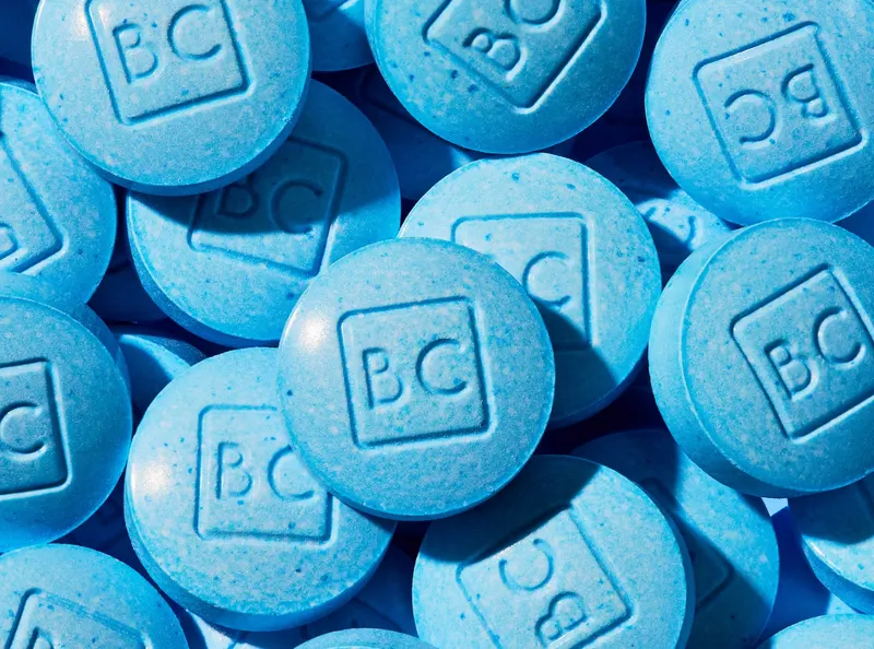 bluechew sublingual tablets piled with "BC" imprint