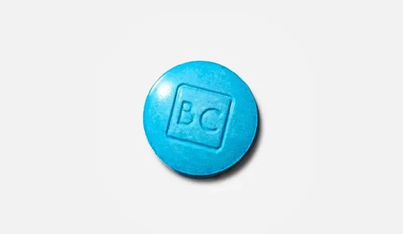 close up of single bluechew tablet with 'BC' imprint