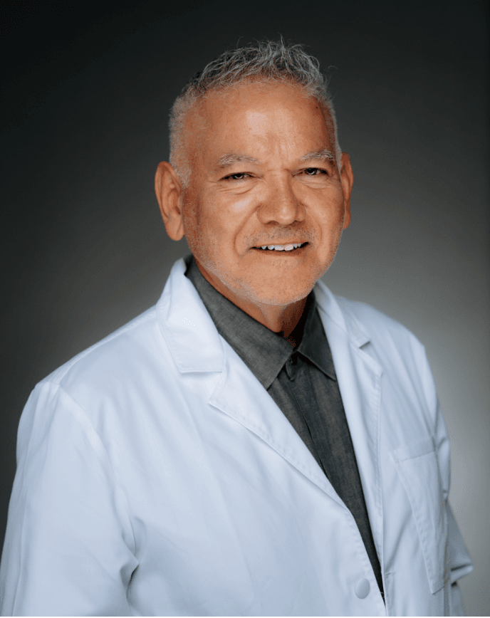 dr thomas cuevas physician reviewer in white coat
