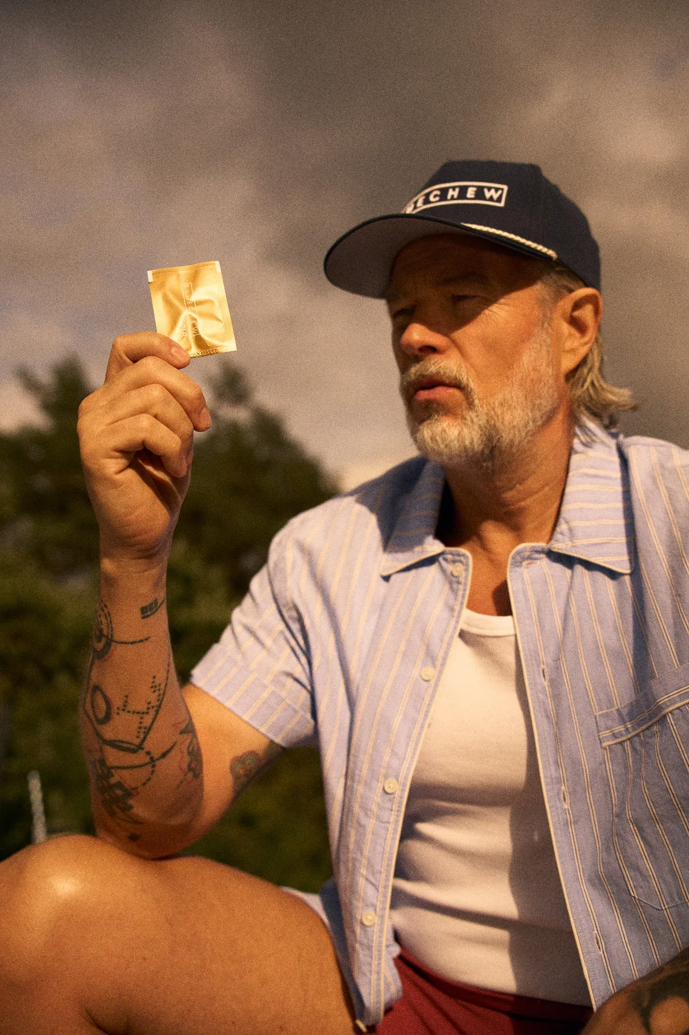 older man with bluechew gold pack outside