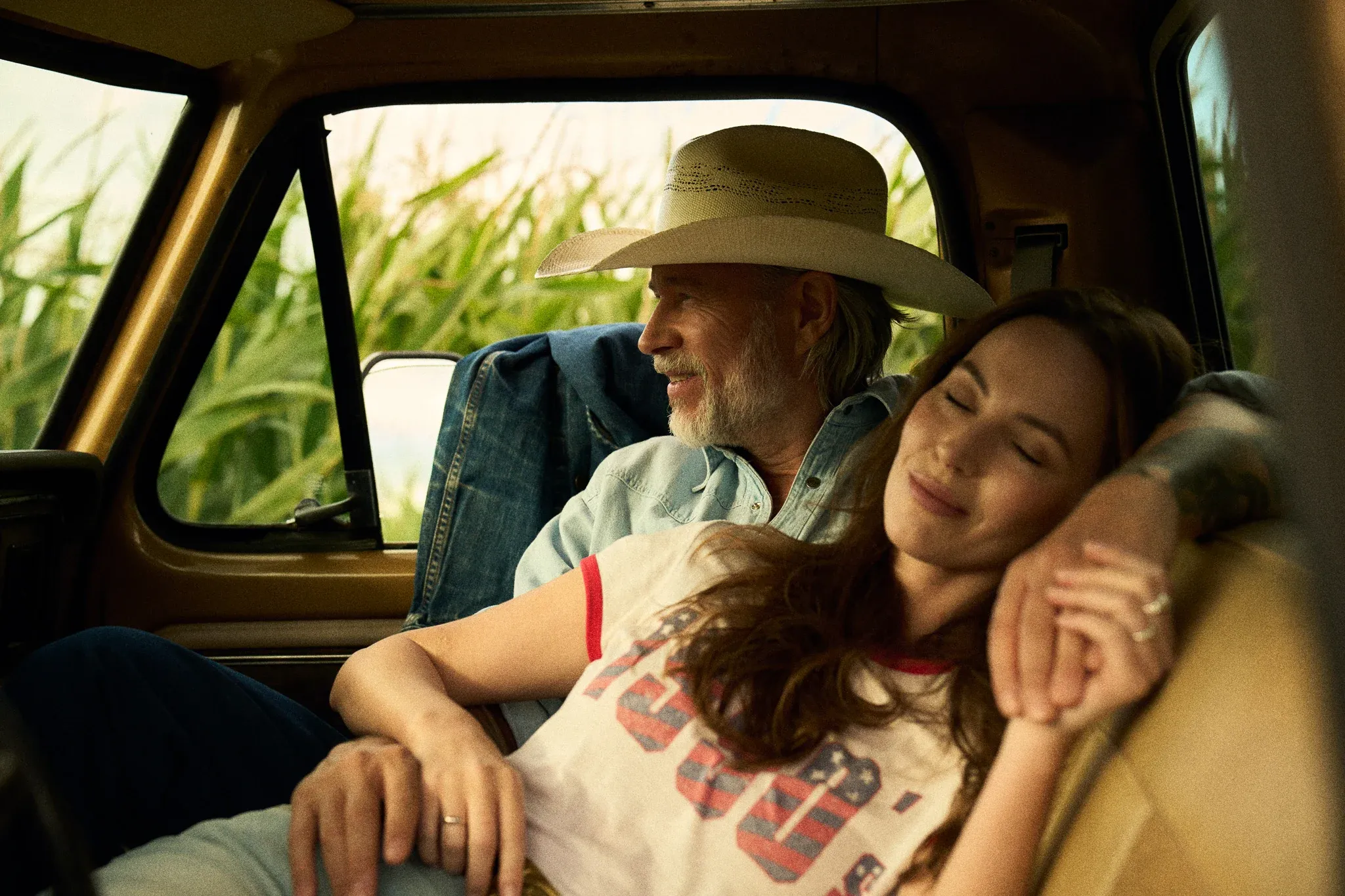 happy couple in pickup truck with bluechew gold